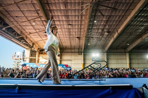 Vice President Kamala Harris waves to the crowd at Signature Aviation Hangar in Detroit on Aug. 7, 2024. Harris' campaign said 15,000 people attended the rally.
