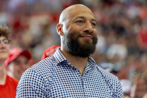 Royce White, candidate for U.S. Senate, listens as Republican presidential candidate Donald Trump speaks at a campaign rally on, July 27, 2024, in Saint Cloud, Minnesota.