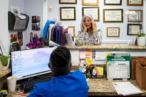 Eileen Diamond, director of Benjamin Surgical Services International (BSSI), talks with a staff member of the clinic on Aug. 13.