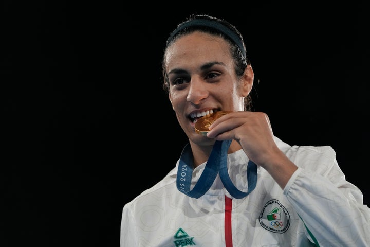 Imane Khelif celebrating with her gold medal