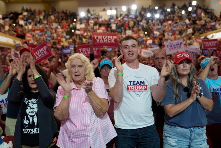 Supporters arrive before Republican presidential nominee former President Donald Trump speaks at a campaign rally in Asheville, N.C., Wednesday, Aug. 14, 2024. (AP Photo/Matt Rourke)