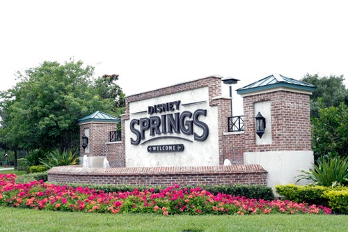 A sign near one of the entrances to Disney Springs is seen May 18, 2020, in Lake Buena Vista, Florida.