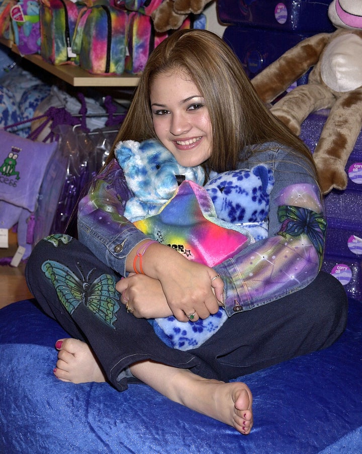 Myra, a pop singer best known for her song "Miracles Happen (When You Believe)" for the Princess Diaries, poses for a promotional event at a Limited Too store. 