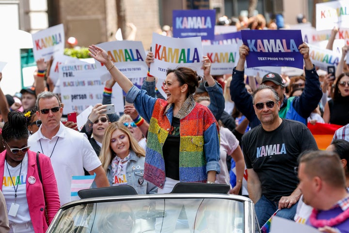 Then-vice presidential candidate and Sen. Kamala Harris (D-Calif.) waves to parade attendees alongside husband Doug Emhoff (right) during the 2019 San Francisco Pride parade on June 30, 2019.