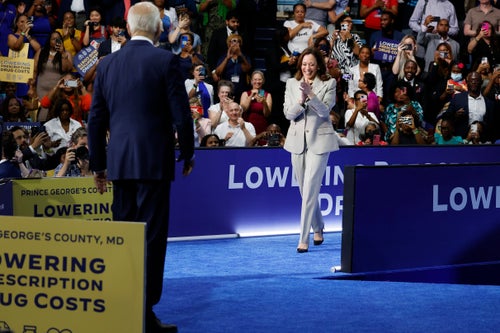 President Joe Biden and Vice President Kamala Harris walk off stage after the end of their remarks at Prince George’s Community College on Thursday in Largo, Maryland, where they talked about their administration's efforts to lower drug costs. 