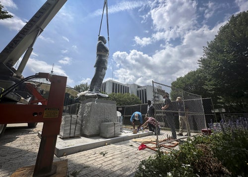 A large bronze statue of the late civil rights leader and politician Congressman John Lewis is installed where a monument to the Confederacy was brought down in 2020, in the wake of the death of George Floyd, Friday, Aug. 16, 2024, in Decatur, Ga. (AP Photo/Ron Harris)
