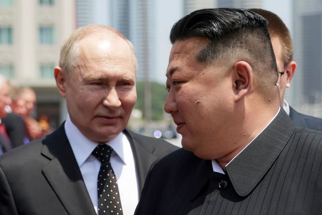 Vladimir Putin, left, and North Korea's leader Kim Jong Un 