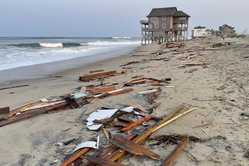 This photo provided by the National Park Service on Aug. 16, 2024, in Rodanthe, N.C., along the Cape Hatteras National Seashore shows debris from an unoccupied beach house that collapsed into the Atlantic Ocean from winds and waves caused by Hurricane Ernesto.