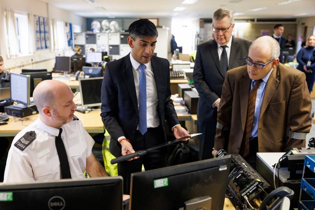 Former prime minister Rishi Sunak picks up a zombie knife while visiting Harlow Police Station in February.