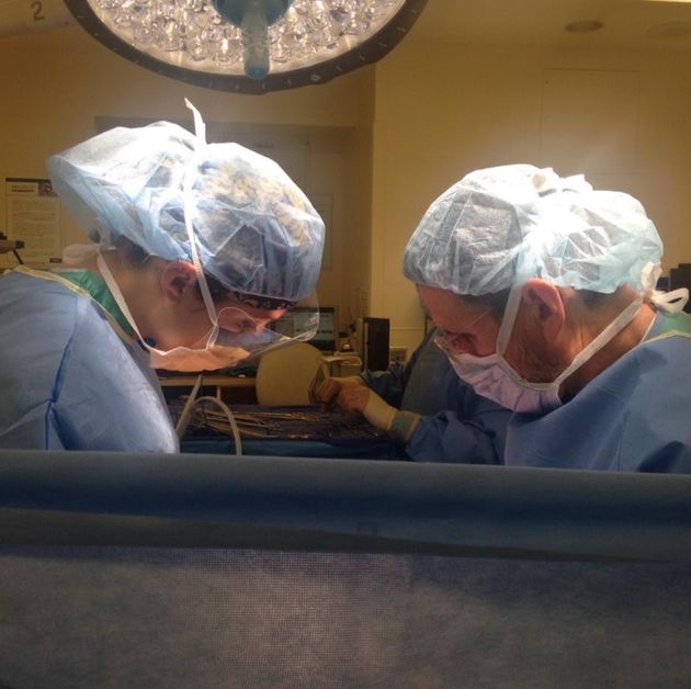 The author, left, in the operating room.