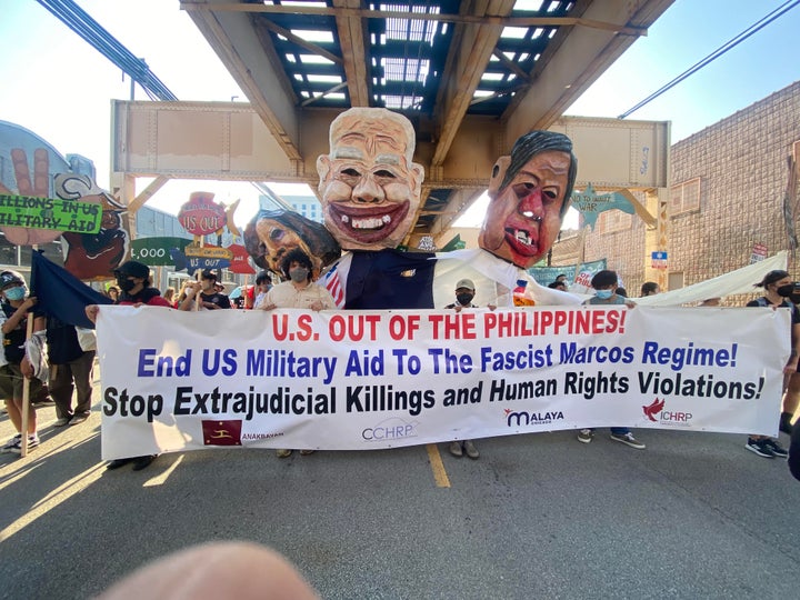 Protesters during the March on the DNC on Monday in Chicago call for an end to U.S. military aid to the Philippines.