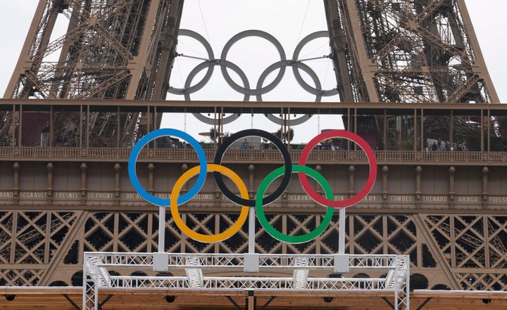 The Olympic Rings on the Blind Football venue for Paris 2024 Paralympic Games at Champ-de-Mars next to the Eiffel Tower in Paris, Sunday, Aug. 18, 2024. (AP Photo/Michel Euler)