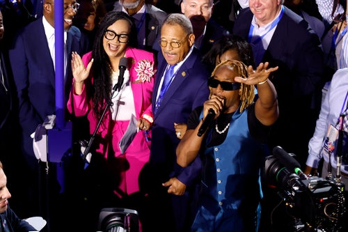 Rapper Lil Jon (right) performs with the Georgia delegation during the Ceremonial Roll Call of States on the second day of the Democratic National Convention at the United Center on Tuesday in Chicago, Illinois. 