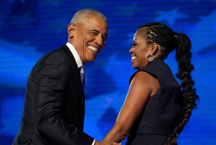 Former President Barack Obama hugs former first lady Michelle Obama as he is introduced during the Democratic National Convention on Tuesday in Chicago.