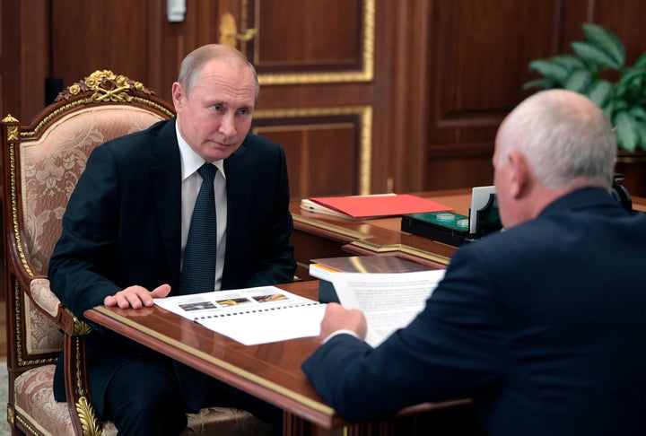 Russian President Vladimir Putin, left, with his close ally Sergei Chemezov, the head of the state corporation RosTech.