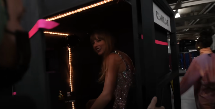 Taylor Swift in the "cleaning cart" that takes her to the stage every night on the Eras Tour