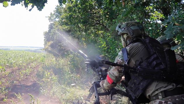 Russian soldiers fire an AGS-17 automatic grenade launcher towards Ukrainian positions at an undisclosed location in the Russian - Ukrainian border area in the Kursk region, Russia. 