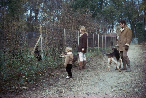 Delon with his former wife Nathalie Delon, and their son Anthony Delon, at home with a few of their dogs.