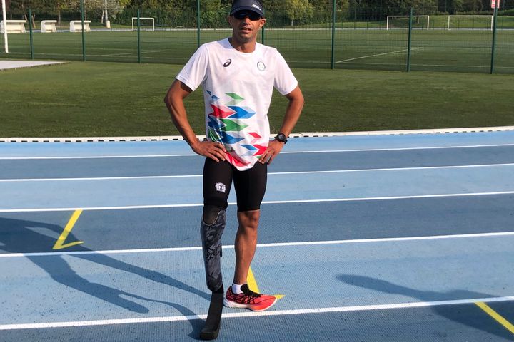 Member of the Refugee Paralympic Team Ibrahim Al Hussein, who will compete in the Para triathlon, poses at a training camp, ahead of the Paralympic Games, Monday, Aug. 19, 2024 in Reims, eastern France. (AP Photo/Patrick Hermansen)