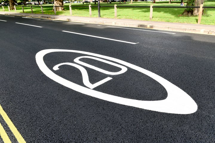 20 mph sign painted on road