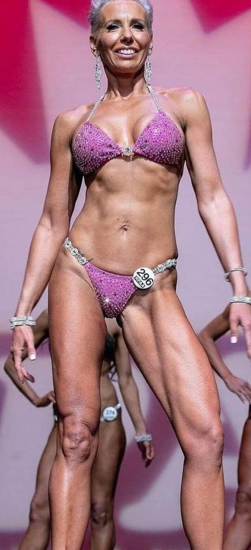 The author on stage at the Natural Physique and Athletics Association competition in 2019.