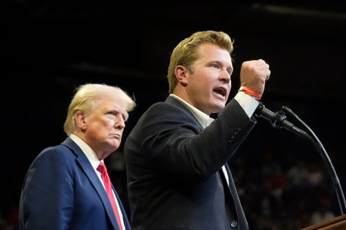 Republican presidential nominee Donald Trump listens as Montana GOP Senate candidate Tim Sheehy speaks at a campaign rally in Bozeman, Montana, earlier this month.