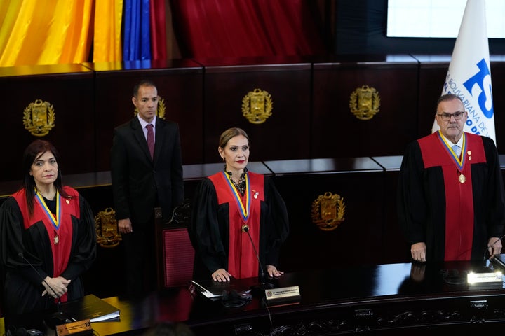 Supreme Court Judges, from left, Fanny Marquez, President Caryslia Rodriguez, and Inocencio Figueroa stand during a ceremony after the Court's audit of the disputed results of the presidential election in Caracas, Venezuela, on Thursday.