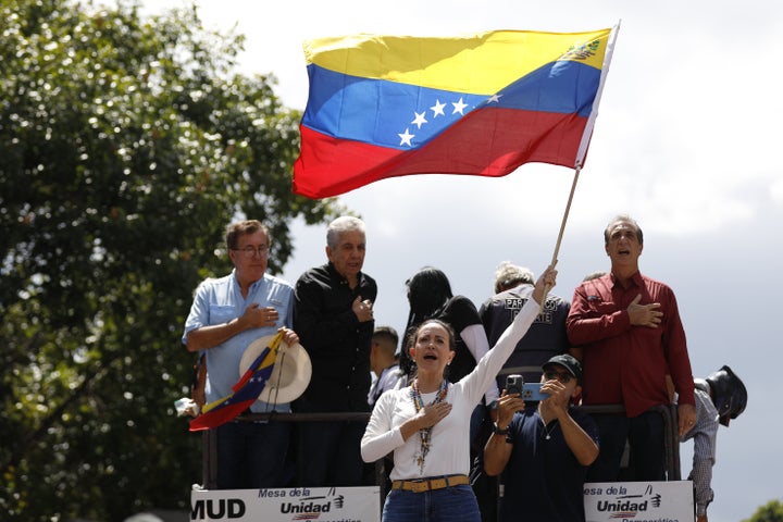 Opposition leader Maria Corina Machado greets her followers during a demonstration to protest the official results that declared President Nicolas Maduro as the winner of the July elections, in Caracas, Venezuela, on August 17.