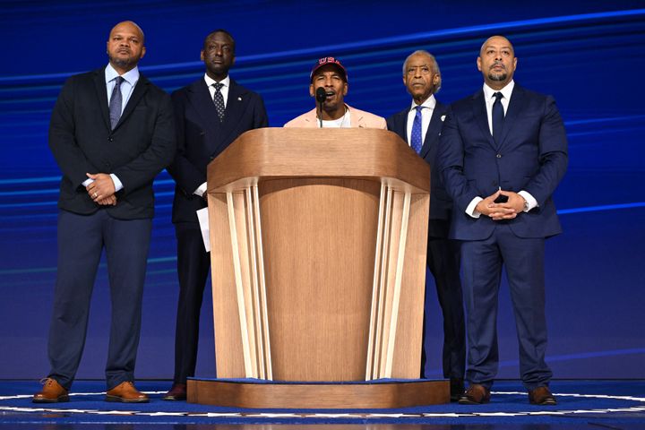 TOPSHOT - US civil rights activist Rev. Al Sharpton (2nd R) is joined onstage by members of the "Central Park Five," activist Kevin Richardson (L), New York City Council member Yusef Salaam (2nd L), Korey Wise (C), and Raymond Santana (R) on the fourth and last day of the Democratic National Convention (DNC) at the United Center in Chicago, Illinois, on August 22, 2024. 