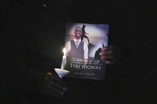 A crowd gathers to remember Tyre Nicholas during a candlelight vigil on the anniversary of his death in Memphis, Tennessee. 