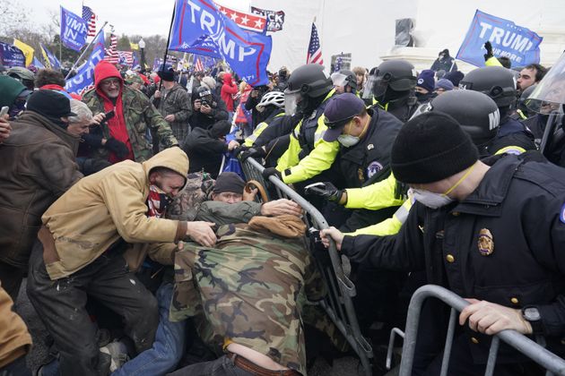 Trump supporters swarm law enforcement officers at the U.S. Capitol on Jan. 6, 2021, after Trump lost the 2020 presidential election.