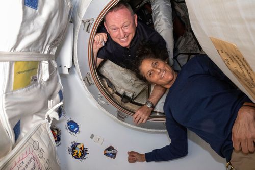 In this photo provided by NASA, Boeing Crew Flight Test astronauts Butch Wilmore, left, and Suni Williams pose for a portrait inside the vestibule between the forward port on the International Space Station's Harmony module and Boeing's Starliner spacecraft on June 13, 2024. (NASA via AP, File)