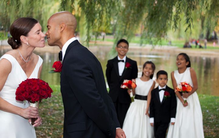 The author and her husband in 2012 at their vow renewal on Boston Common. Their kids are looking on in the background.