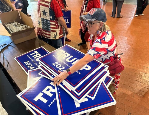 Ginger Hurmence of Lincolnton, Georgia, picks up Donald Trump yard signs on May 18 at the Georgia Republican Party State Convention in Columbus.