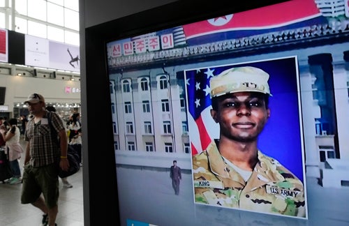 A television screen shows a file image of Pvt. Travis King during a news program at the Seoul Railway Station in Seoul, South Korea, on Aug. 16, 2023.