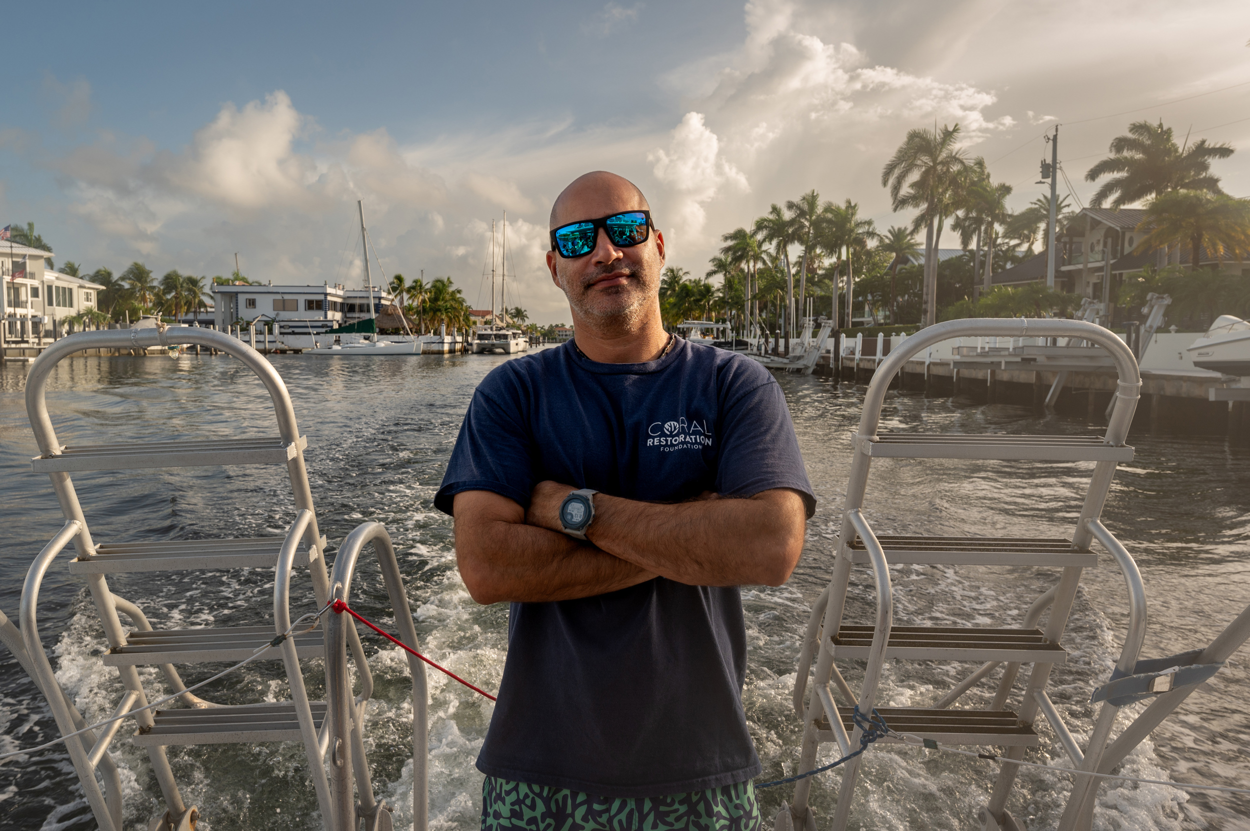 Phanor Montoya-Maya, who has a doctorate in marine biology and is the coral reef restoration program manager for the Coral Restoration Foundation, rides on a boat to one of CRF's offshore nurseries near Key Largo, Florida.