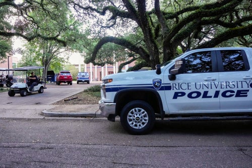 A Rice University campus police vehicle sits parked Monday after an apparent murder-suicide at Jones College, one of the residential colleges at Rice University, according to authorities.