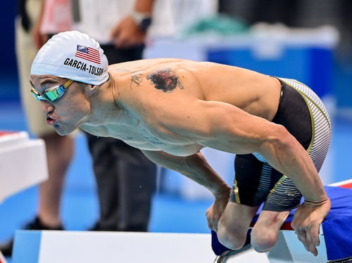 Rudy Garcia-Tolson, pictured competing at the Tokyo Paralympic Games, had to scribble a Sharpie over his Olympics rings tattoo.