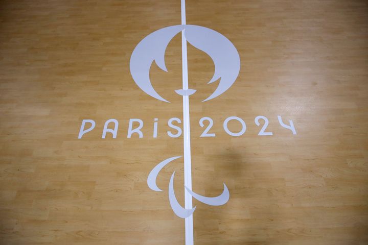 The logo of the Paralympic Games is seen on the Goalball pitch during a visit of the Arena Paris Sud venue ahead of the Paralympic Games, Monday, Aug. 19, 2024 in Paris. (AP Photo/Aurelien Morissard)