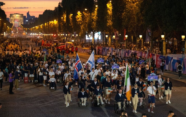 Ireland athletes are led by flagbearers Orla Comerford, right, and Colin Judge during the opening ceremony of the Paris 2024 Paralympic Games at Place de la Concorde in Paris, France.