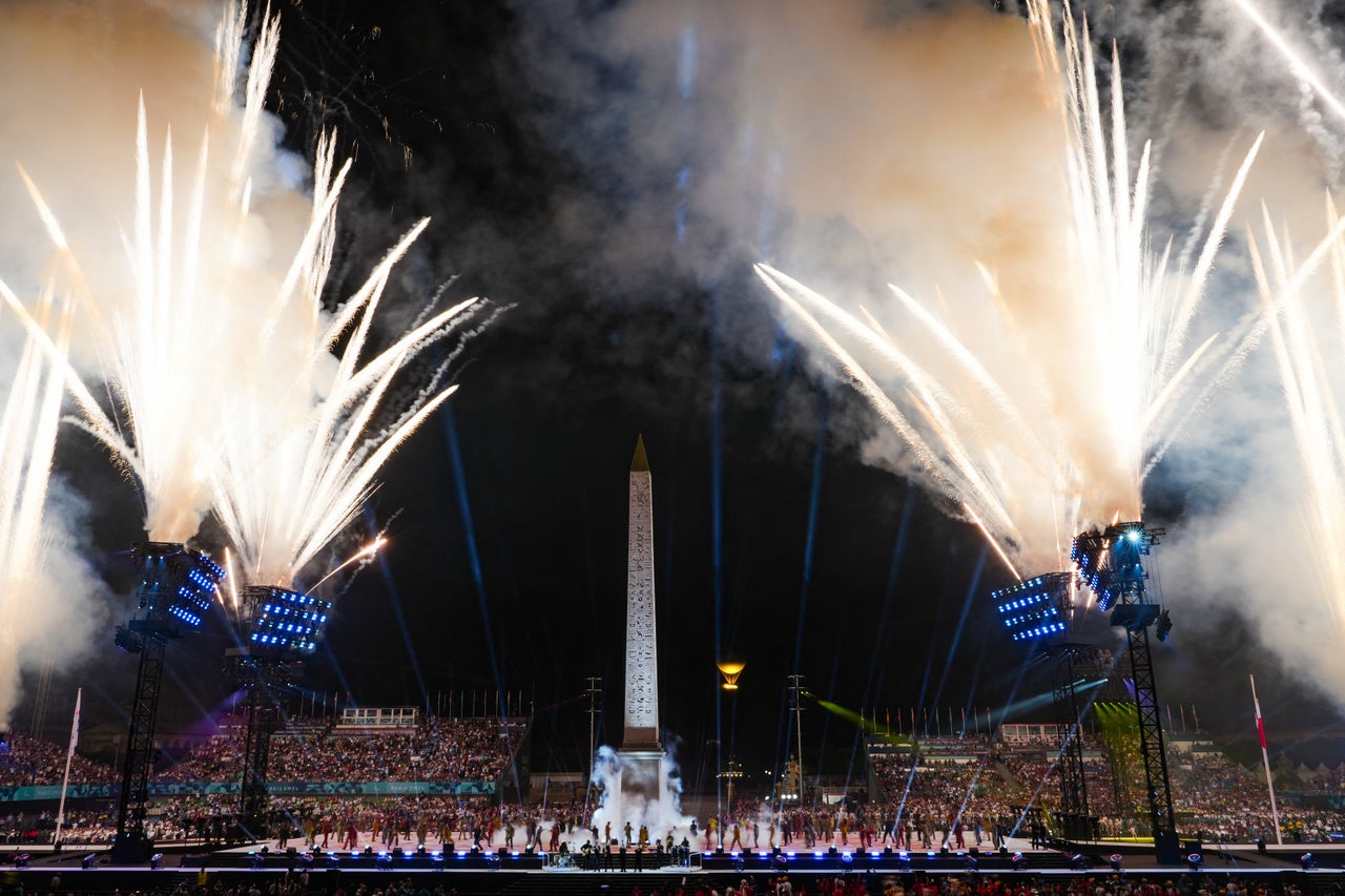 Fireworks explode next to the Obelisque de Louxor, the main monument in the square.