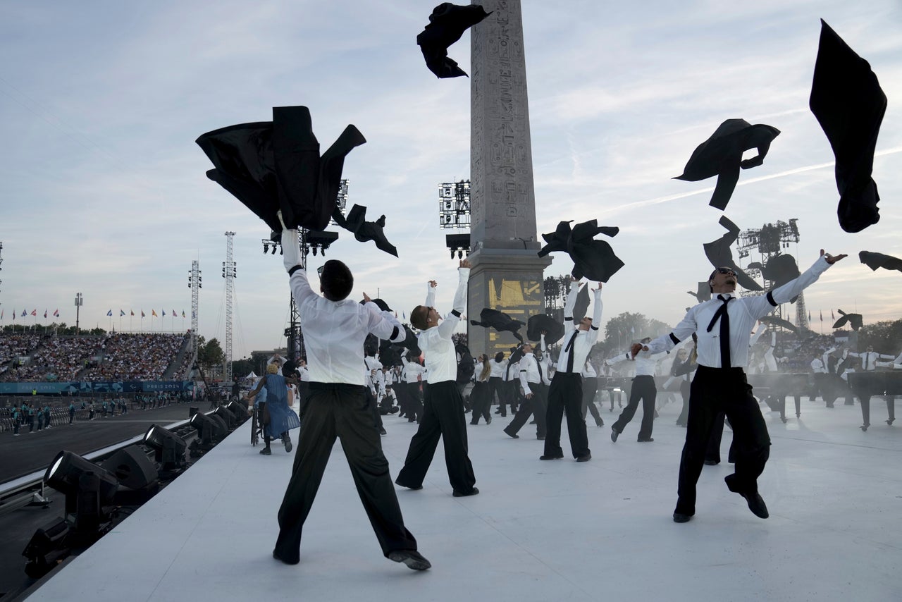 Artists perform at the start of the opening ceremony.