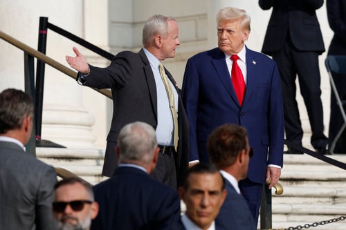 ARLINGTON, VIRGINIA - AUGUST 26: Republican presidential nominee, former U.S. President Donald Trump (R) observes a changing of the guard at the Tomb of the Unknown Soldier alongside Arlington National Cemetery Deputy Chief of Staff Bob Quackenbush (L) at the Arlington National Cemetery on August 26, 2024 in Arlington, Virginia. Trump visited Arlington National Cemetery to participate in a wreath laying ceremony to mark three years since the August 26, 2021, suicide bombing at Hamid Karzai International Airport, which killed 13 American service members. (Photo by Anna Moneymaker/Getty Images)