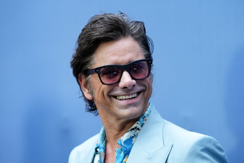 John Stamos attends the premiere of "UnPrisoned" in July. He told a story about his brief encounter with Scientology during a podcast interview released over the weekend.