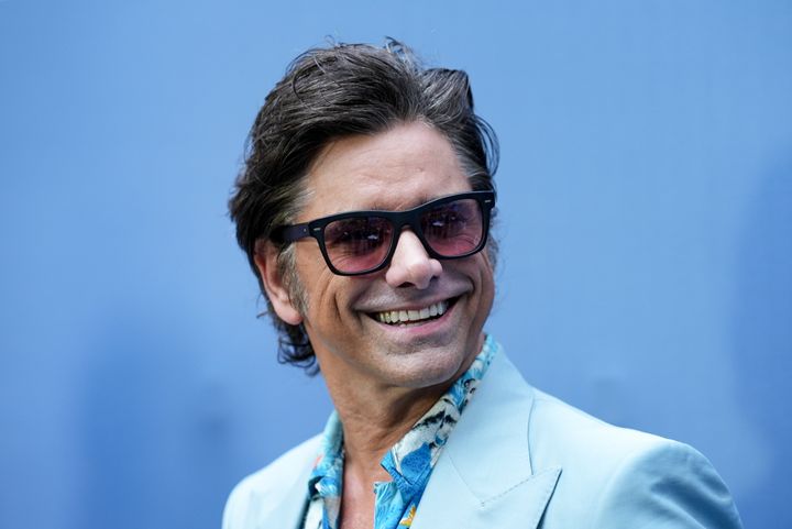 John Stamos attends the premiere of "UnPrisoned" in July. He told a story about his brief encounter with Scientology during a podcast interview released over the weekend.