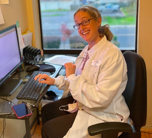 The author, who is smiling because she just finished updating the chart on her last patient before a Thanksgiving break.