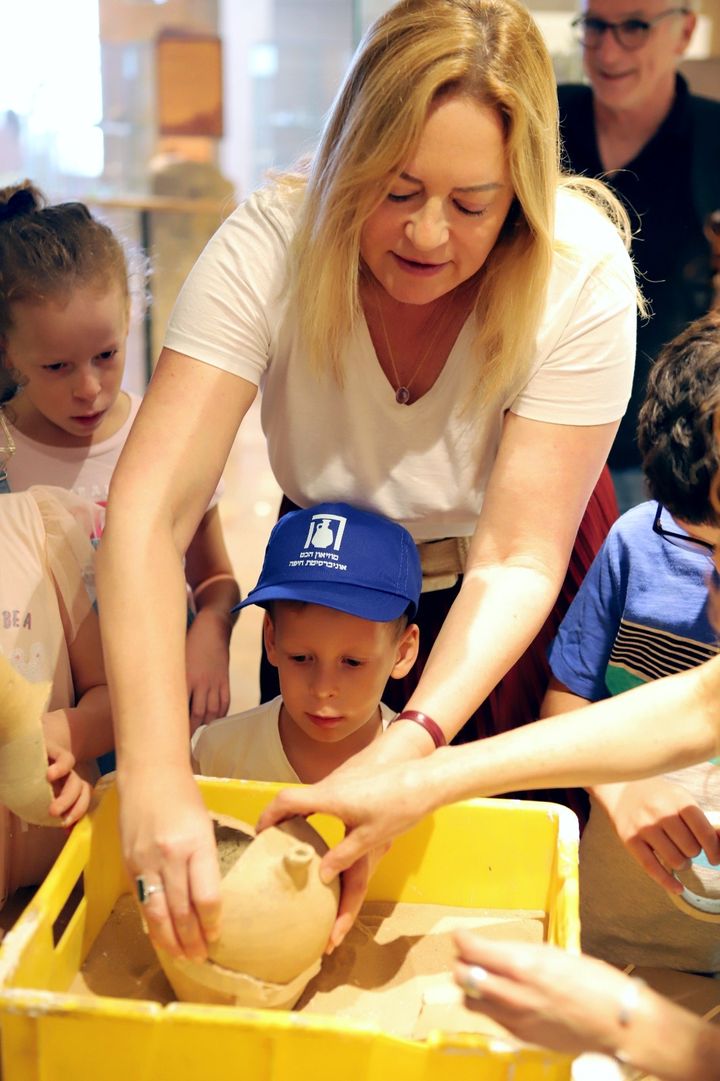 Ariel, 4, was presented with another broken jar and received a hands-on opportunity to learn how archeological artifacts are restored.