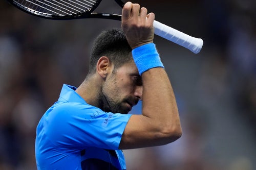 Novak Djokovic, of Serbia, wipes his face during a third round match against Alexei Popyrin, of Australia, in the U.S. Open tennis championships, Friday, Aug. 30, 2024, in New York. (AP Photo/Julia Nikhinson)