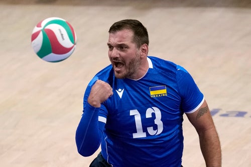 Dmytro Melnyk of Ukraine reacts during the men's preliminary round sitting volleyball game against Iran at the 2024 Paralympics, Friday, Aug. 30, 2024, in Paris, France. (AP Photo/Christophe Ena)
