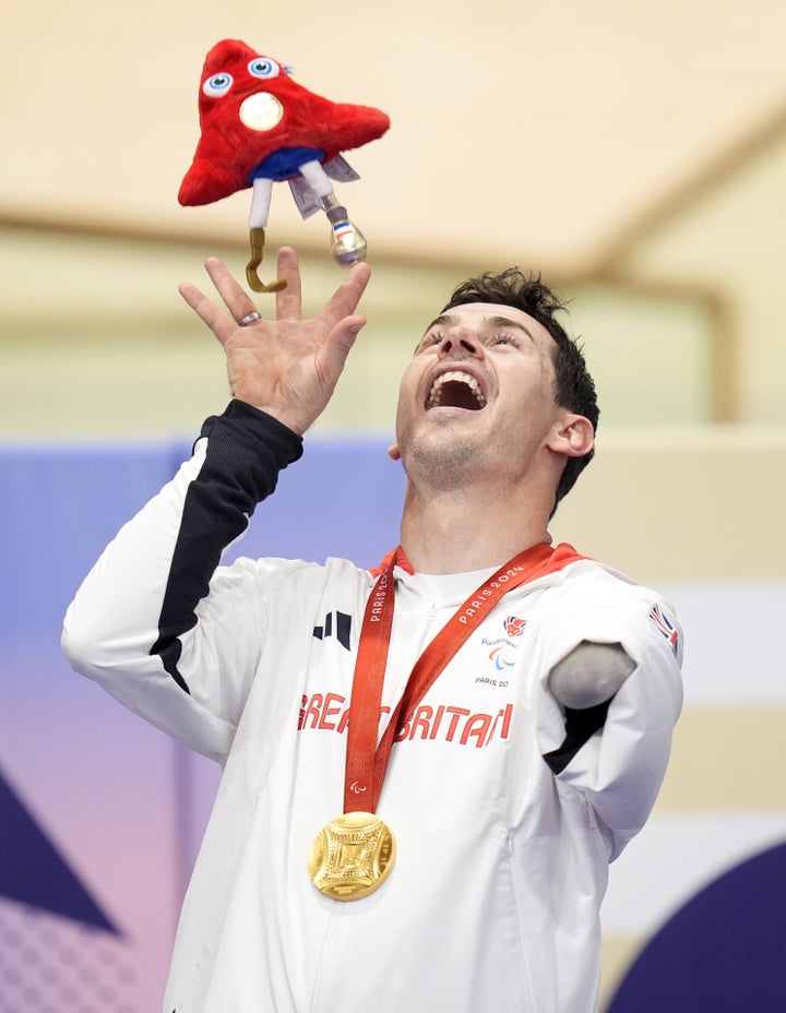 Great Britain's Jaco van Gass celebrates after receiving his gold medal for the Men's C3 3000m Individual Pursuit during the Para Track Cycling at the National Velodrome on day two of the Paris 2024 Summer Paralympic Games.